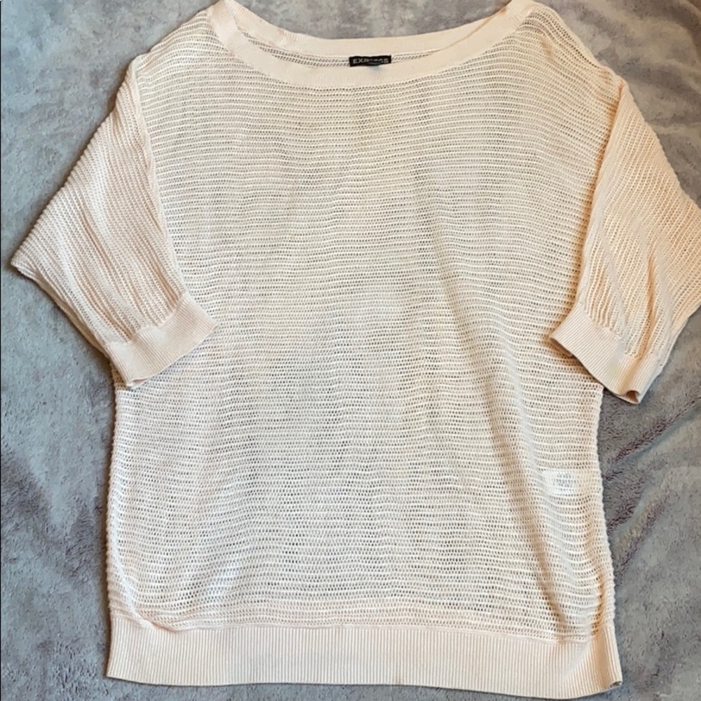 Light pink sweater like coverup shirt.